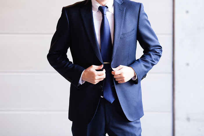5 Habits That Help Average People Make Millions torso of caucasian man wearing navy blue suit and tie