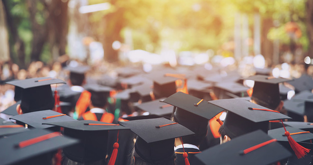 The Alternative to Saddling Your College Kid With Student Loans (as Taught by Real Estate) backside graduation hats during commencement ceremony