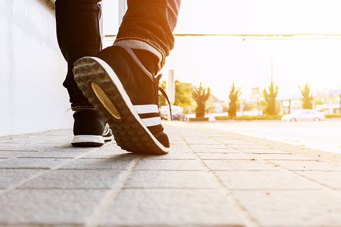 How to Generate $10,000 in Passive Income Monthly Without Quitting Your Day Job hipster walking on the street with soft-focus in the background. over light and film colors tone