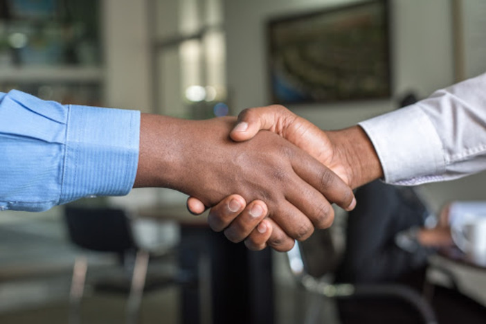 5 Questions to Ask When Considering an Investment Partner handshake