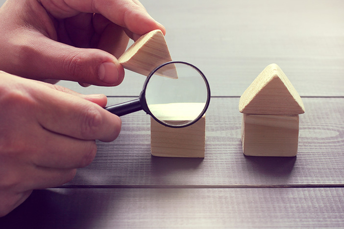 The Ultimate Guide to Due Diligence viewing in a magnifying glass the design of a house layout / inspection of construction objects