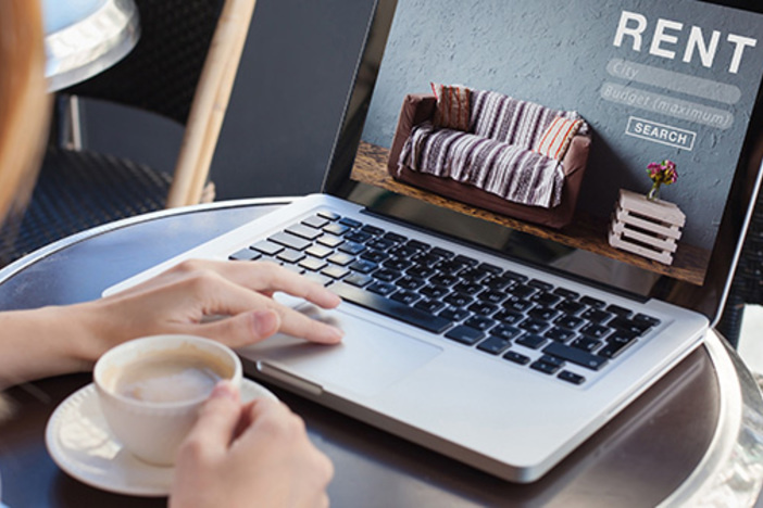 Landlording Made Easy: 12 Hands-Off Strategies woman using internet website for rental apartments, houses