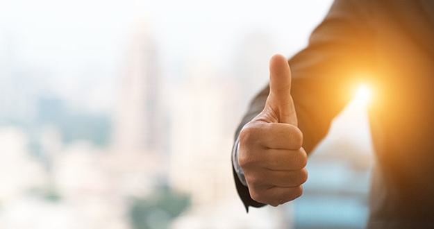 Point-Counterpoint: Debt Is Good When It Comes to Real Estate good hand, good job , man show thump up for agreement sign with success business concept.