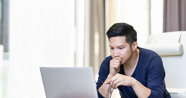 The 5 Financial Decisions That Make or Break Middle-Class Americans confident asian young freelancer in smart casual working and concentrated on laptop sitting on desk in modern office ,co-working space or at home with copy space, webinar over the internet