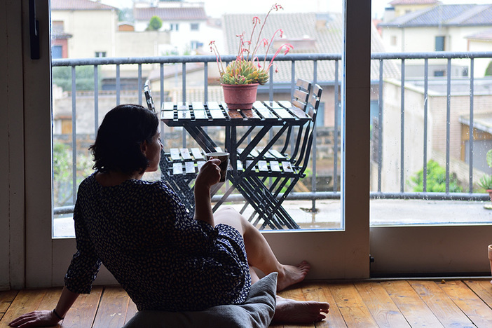 Looking Back, Racing Toward Retirement Was a BIG Mistake sad woman sitting and looking out the window