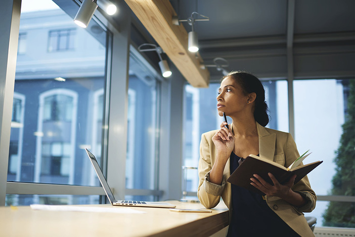 Why All Real Estate Investors Should Have Solid Life Insurance Coverage Skillful professional female thinking over organizing work in office and employee while being in business trip waiting for meeting with partners using laptop and wireless connection in coworking space