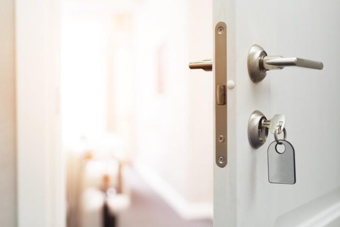 Unlock the Potential of Investing in Private Real Estate open door-unlock