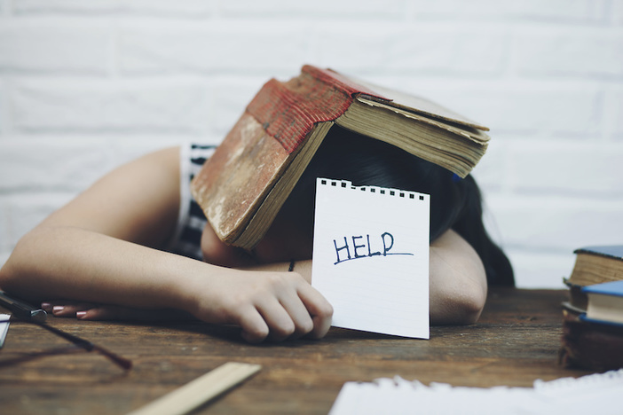 12 Influential Investors Weigh in on How to Survive the Coronavirus Crisis Girl sleeping with holding a sign with the word Help!