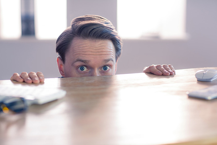 Warning: 5 Reasons the 2020 Recession Will Be Far Worse Than 2008 Nervous businessman peeking over desks