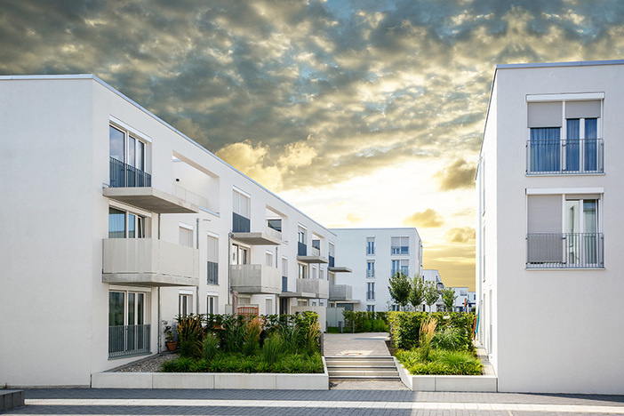 What Investors Should Know About Rent to Income Ratio (+5 Great RTI Markets) white apartment complex