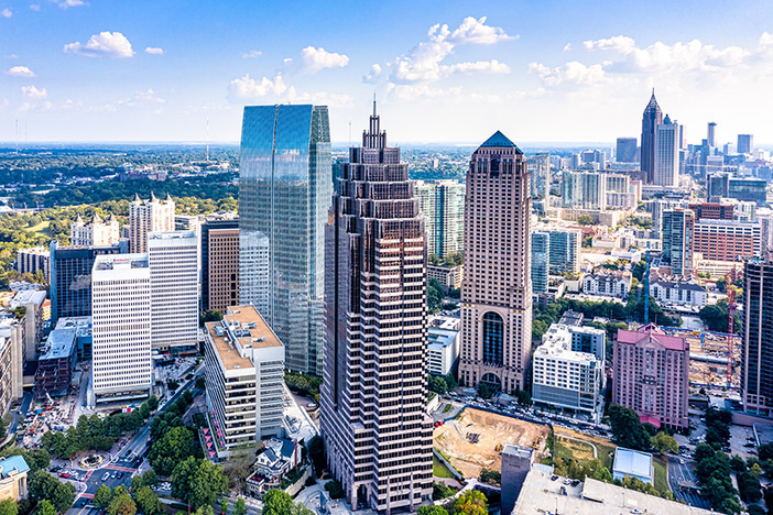 How to Achieve Steady Cash Flow on Your Remote Investment Aerial view downtown Atlanta skyline