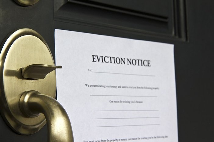 The Eviction Process in 7 Steps (Plus, How to Save $3,500 and a Ton of Time) Eviction notice letter pasted on front door of house