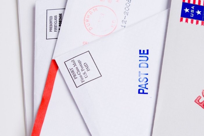 The Top 6 Reasons Why Landlords Should Charge Late Rent Fees Small group of envelopes marked "PAST DUE" and "FORECLOSED". Suggesting tough economic times US.