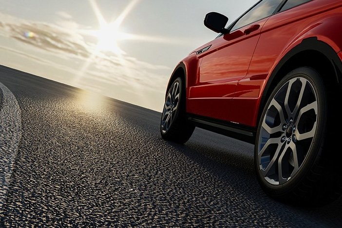 Want to Be a Bona Fide Entrepreneur? Avoid These “Wantrepreneur” Habits! brand new red sedan driving on dark pavement with sunbeam ahead in partly cloudy sky